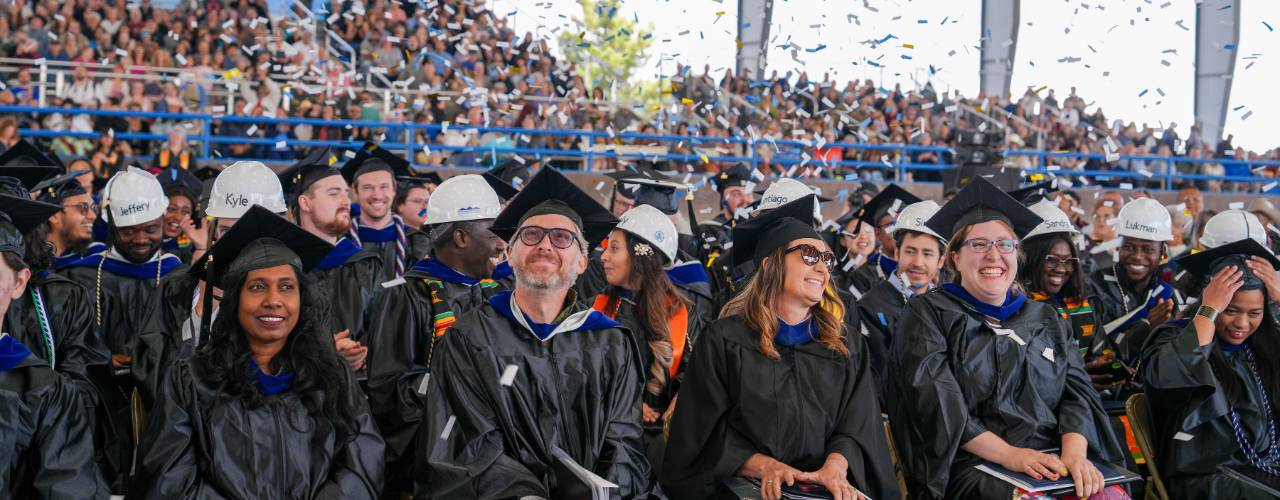 Hero Image of students standing at graduation.